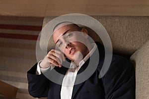 Young Businessman Resting on Sofa at Home