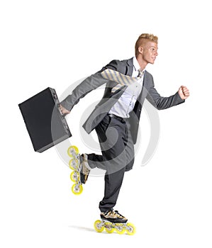 Young businessman on rollerblade photo