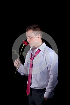Young businessman with rose