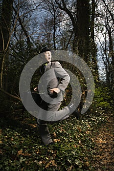 Young Businessman Running In Woods