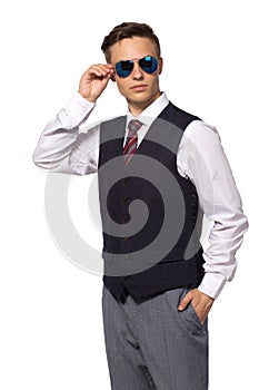 Young businessman in shirt and tie wear sunglasses isolated on white