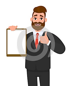 Young businessman showing blank clipboard and making thumb up gesture sign. Person holding notepad. Male character design.