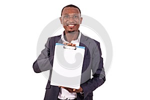 Young businessman showing blank paper on clipboard smiling