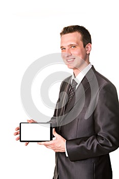 Young businessman showing a tablet pc comuter with blank screen for your sample text