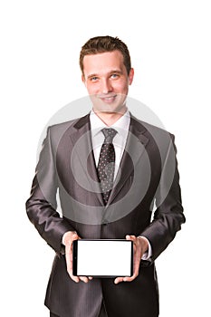 Young businessman showing a tablet pc comuter with blank screen for your sample text