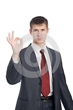 Young businessman shows gesture okay