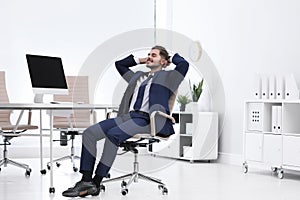 Young businessman sitting on office chair