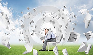 Young businessman sitting on an office chair