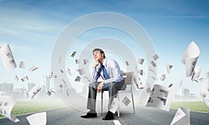 Young businessman sitting on an office chair