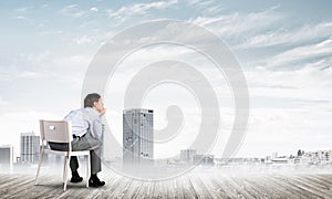 Young businessman sitting on an office chair