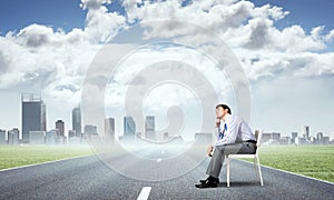 Young businessman sitting on an office chair