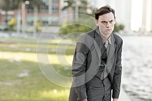 Young businessman slouching