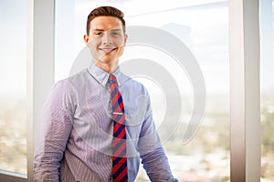 Young businessman smiling