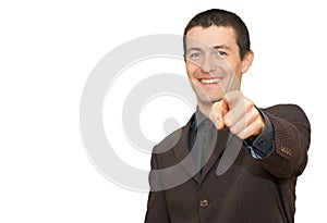 Young businessman smiling and pointing