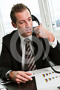 Young businessman speaking on the phone