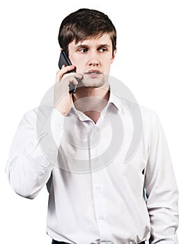 Young businessman speaks on the phone