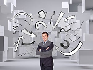 Young businessman standing crossarmed