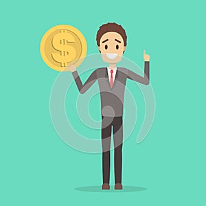 Young businessman standing and holding a coin