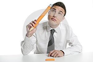 Young businessman student thinking with pencil