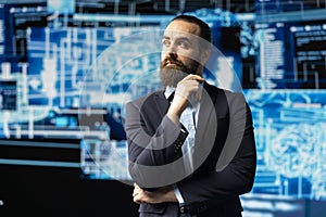 Young businessman studies artificial intelligence neural network on dashboards photo