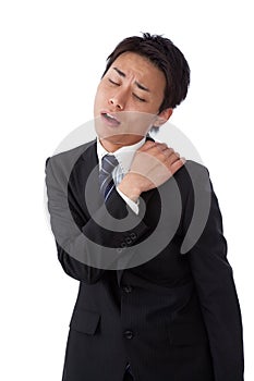 Young businessman suffering from stiff neck