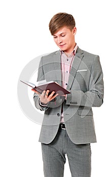 Young businessman in suit with notepad