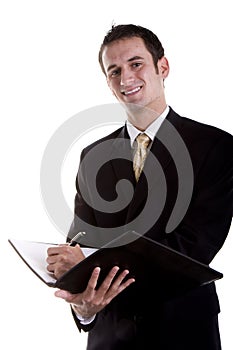 Young Businessman in Suit Writing in Notebook
