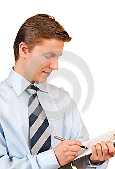 Young businessman taking notes