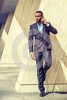 Young Businessman talking on cell phone outside in New York