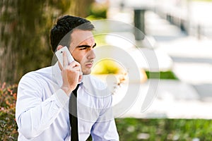 Young businessman talking on cellphone