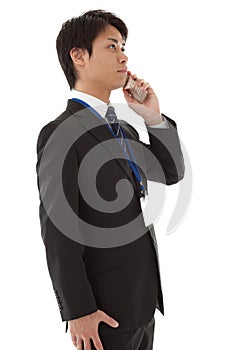 Young businessman is talking on a mobile phone