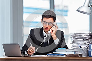 The young businessman talking on the phone