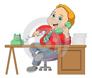 Young businessman talking on a retro wired telephone