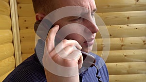 Young businessman talking on the telephone,Close-up of mouth