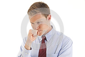 Young businessman thinking with hand on chin