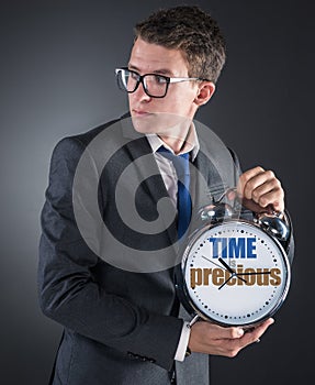 Young businessman time importance concept