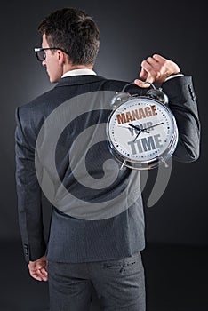 The young businessman time importance concept