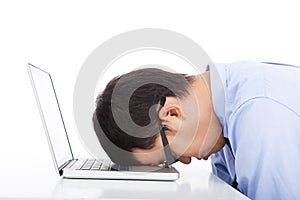 Young businessman too overwork to asleep photo