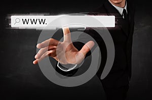 Young businessman touching web browser address bar with www sign