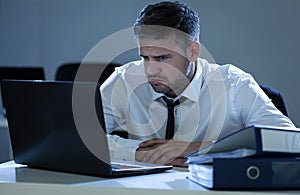 Young businessman trying to solve the problem photo