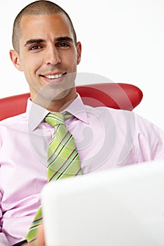 Young businessman using laptop