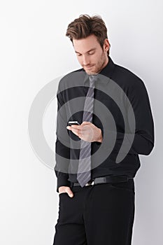 Young businessman using mobile phone