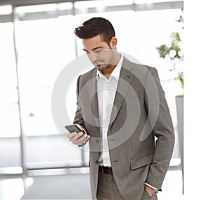 Young businessman using mobilephone