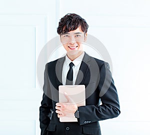 Young Businessman using tablet computer in office