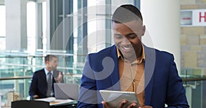 Young businessman using tablet in a modern office