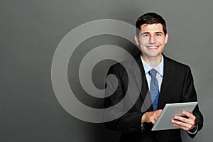 Young businessman using tablet pc