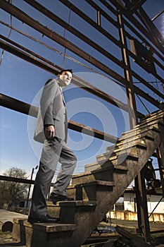 Young Businessman Walking Up Stairs