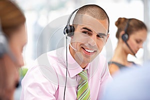 Young businessman wearing headset