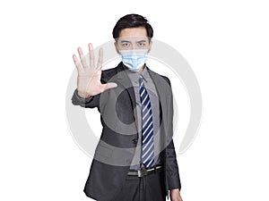 Young businessman wearing medical mask for protection, made  refusal gesture and said no, calling for close contact during covid-1