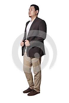 Young businessman wearing suit standing side view. Isolated on white. Full length